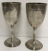 Two Victorian engraved silver trophy goblets,