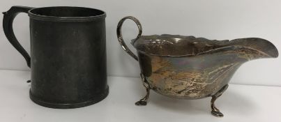 A silver tankard of plain tapered cylindrical form with reeded edge (by Walker & Hall,
