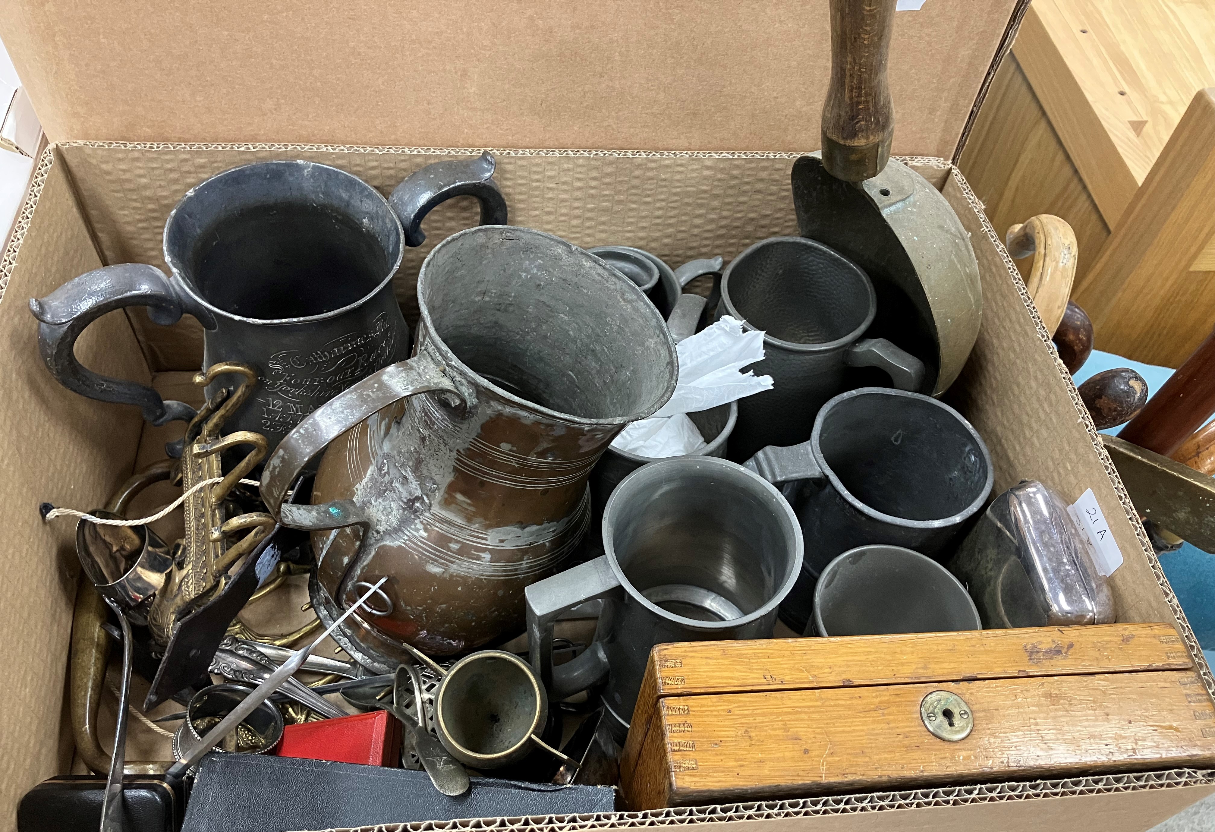 A collection of metal wares to include assorted pewter tankards and measures,