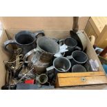 A collection of metal wares to include assorted pewter tankards and measures,