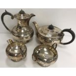 A George V silver four-piece tea set of bellied form, with beaded decoration (by Walker & Hall,