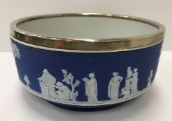 A Wedgwood blue Jasper dip fruit bowl with Classical figure decoration and EPNS rim,