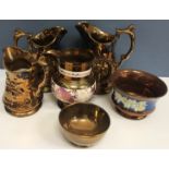 A collection of approximately forty items of Victorian copper lustre ware, mainly various jugs,