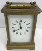 A circa 1900 brass cased carriage clock of typical form,