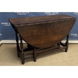 A 19th Century oak oval gate-leg drop leaf dining table 119 cm x 135 cm x 75 cm high together with