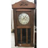 A 1930s oak drop dial wall clock,