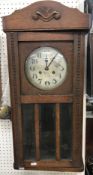 A 1930s oak drop dial wall clock,