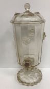 A 19th Century clear glass drink dispenser of bucket form on a pedestal base with applied mouldings,