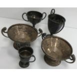 A collection of five various silver twin handled trophy cups,