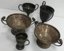 A collection of five various silver twin handled trophy cups,