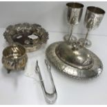 A collection of various small silver and plated wares to include silver sugar tongs,