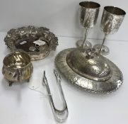 A collection of various small silver and plated wares to include silver sugar tongs,