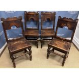 A set of four 19th Century oak back stools in the 17th Century style with fretwork carved top rail