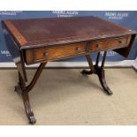 A 20th Century mahogany sofa table in the Regency style,