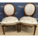 A pair of 19th Century French walnut framed spoon back salon chairs in the Louis XVI taste with