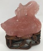 A Chinese rose quartz figure of a mandarin duck with lily in its beak 9.