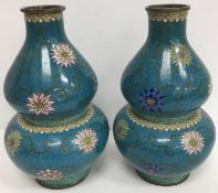 A pair of Chinese turquoise ground cloisonné vases of double gourd form,