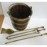 A 19th Century coopered oak and brass bound bucket of slightly tapering form with brass swing