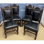 A set of four Victorian carved oak dining chairs with lion mask decorated top rail,