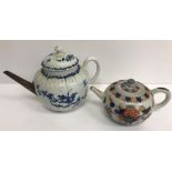 An 18th Century Worcester floral spray and feather moulded bullet shaped teapot with replacement