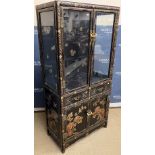 A mid 20th Century black lacquered and chinoiserie decorated display cabinet,