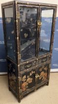 A mid 20th Century black lacquered and chinoiserie decorated display cabinet,