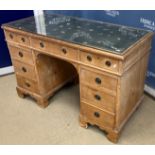 An early 20th Century pine double pedestal desk,
