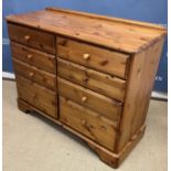 A collection of Ducal pine furniture including a pair of chests of two short over two long drawers