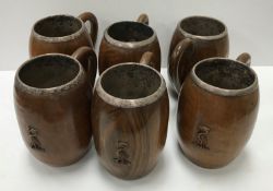 A set of six Indian treen ware and white metal mounted mugs,
