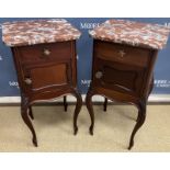 A pair of 20th Century French mahogany pot cupboards in the Louis XV style,
