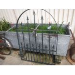 A painted iron garden gate with domed top 131 cm high x 92.