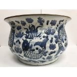 A large early 20th Century Japanese flared bowl with blue and white carp decoration,