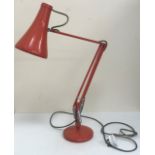 A mid 20th Century Herbert Terry anglepoise light in orange,