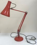 A mid 20th Century Herbert Terry anglepoise light in orange,