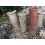 Four large terracotta chimney pots,