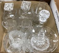 A box containing a quantity of cut and other glassware to include three decanters, vase, fruit bowl,