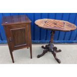 A Victorian walnut and inlaid games top occasional table on turned and carved pedestal to foliate