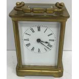 A circa 1900 French brass cased carriage clock on a bracket foot base,