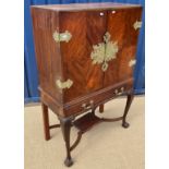 An early to mid 20th Century walnut cocktail cabinet,