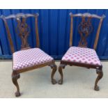 A pair of 19th Century mahogany Chippendale design dining chairs,