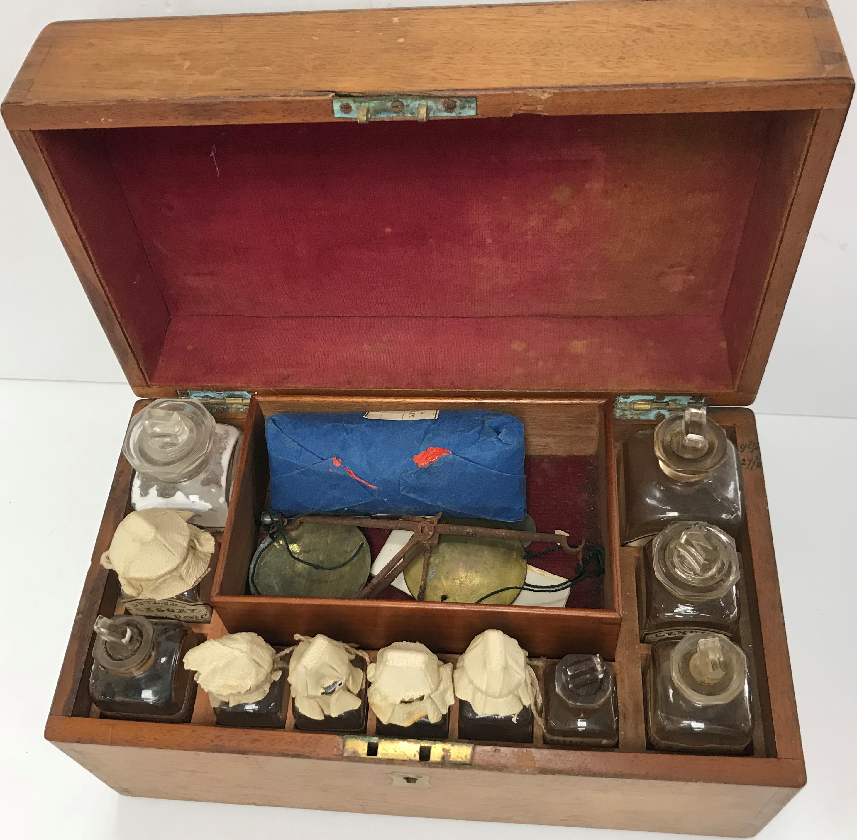 A 19th Century mahogany Apothecary box containing various glass bottles, scales,