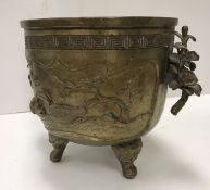 A Chinese cast bronze censer with relief work decoration of wildfowl on water,