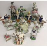 A collection of various china figures including two Mr Punch pottery peppers, 16 cm high,