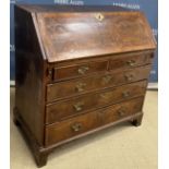 A burr walnut veneered and cross-banded bureau in the early 18th Century manner,