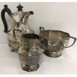 An Edwardian silver twin-handled sugar basin and matching cream or milk jug of hexagonal form,