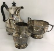 An Edwardian silver twin-handled sugar basin and matching cream or milk jug of hexagonal form,