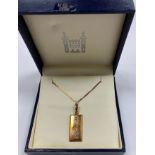 An HMS Victory Nelson and Trafalgar 9 carat gold ingot pendant on chain, limited edition No'd.