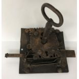 An 18th Century French iron lock and key, the square back plate 20.