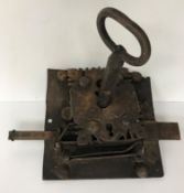 An 18th Century French iron lock and key, the square back plate 20.