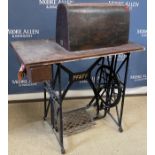 A 19th Century oak and inlaid cased Pfaff treadle sewing machine on cast iron base 86.
